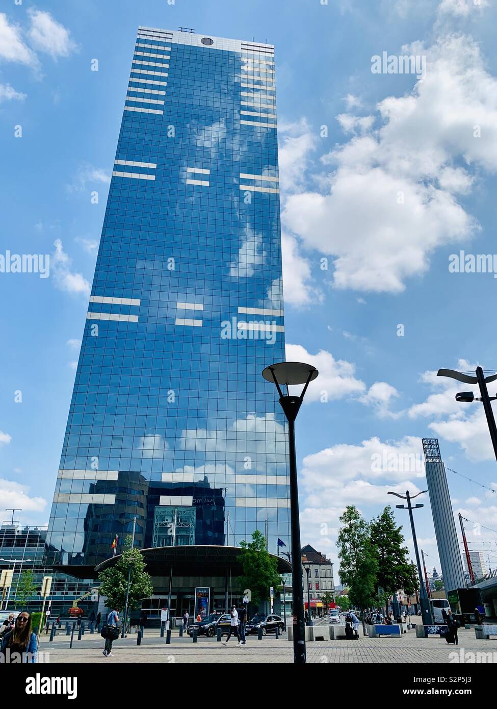 Brussels, Belgium - 1st June 2019: Service federal de pensions. Blue skyscraper outside Midi / Zuid rail station. - Smartphone Captured Stock Image