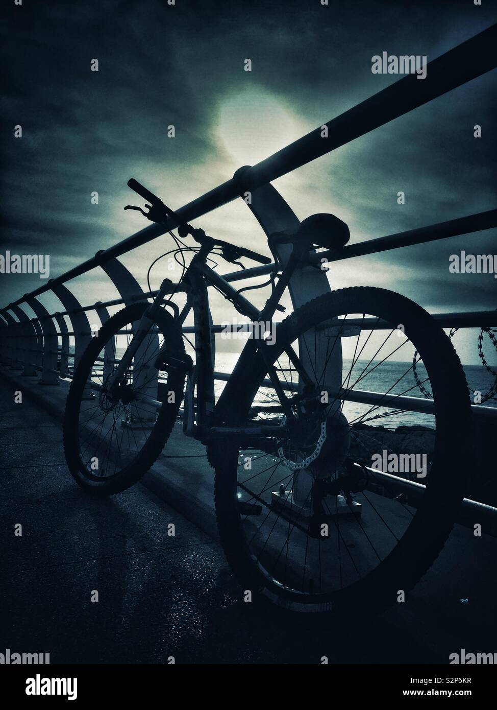 Bike silhouette on the beach Stock Photo