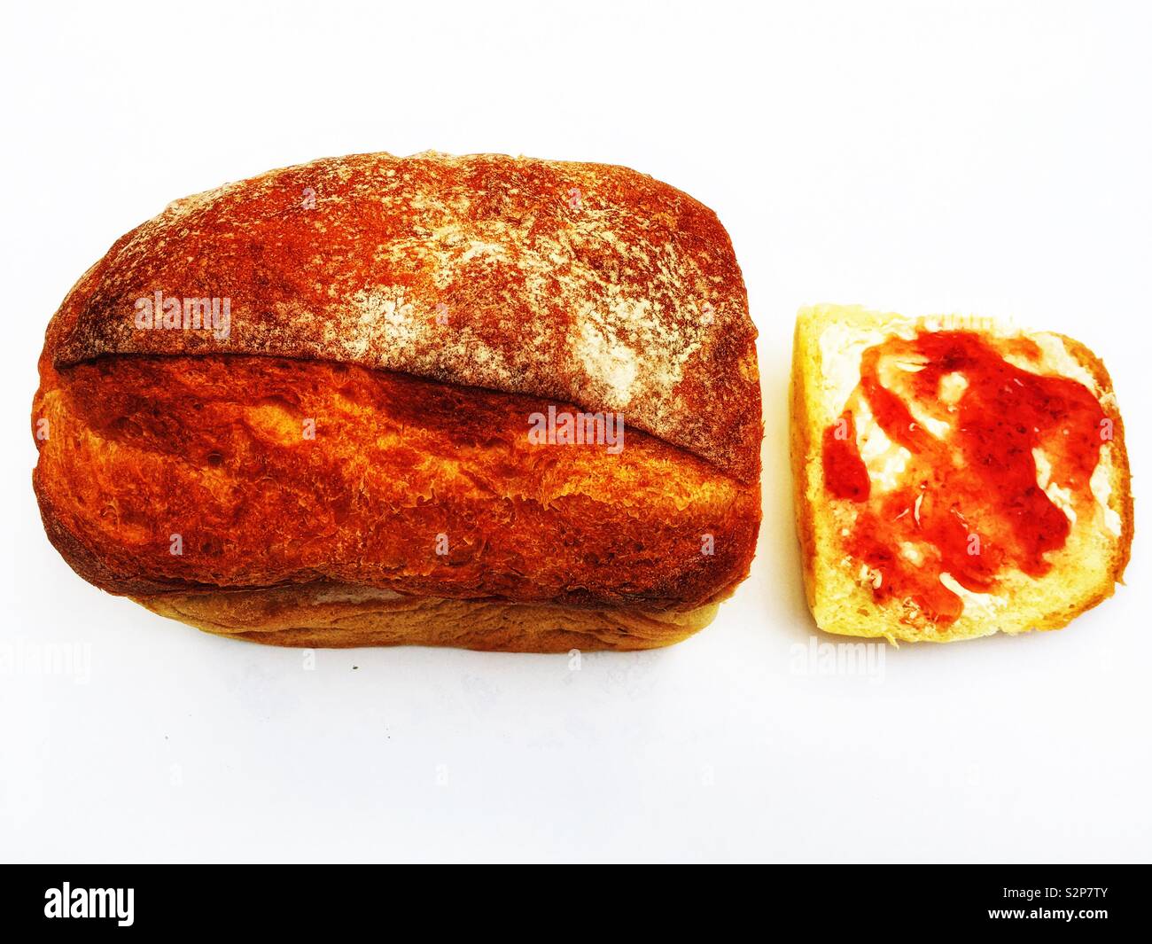 Farmhouse white bread with a buttered and strawberry jam slice - Smartphone Captured Stock Image