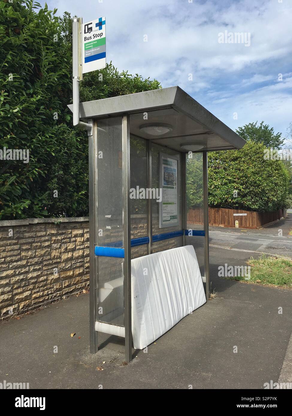 An old mattress dumped at a bus stop in Weston-super-Mare, UK - Smartphone Captured Stock Image