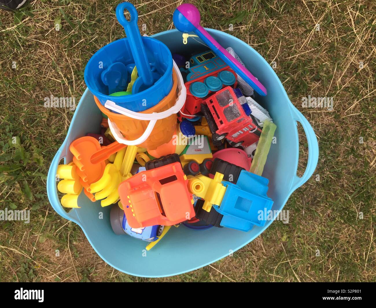 Plastic tub full of plastic summer toys - Smartphone Captured Stock Image