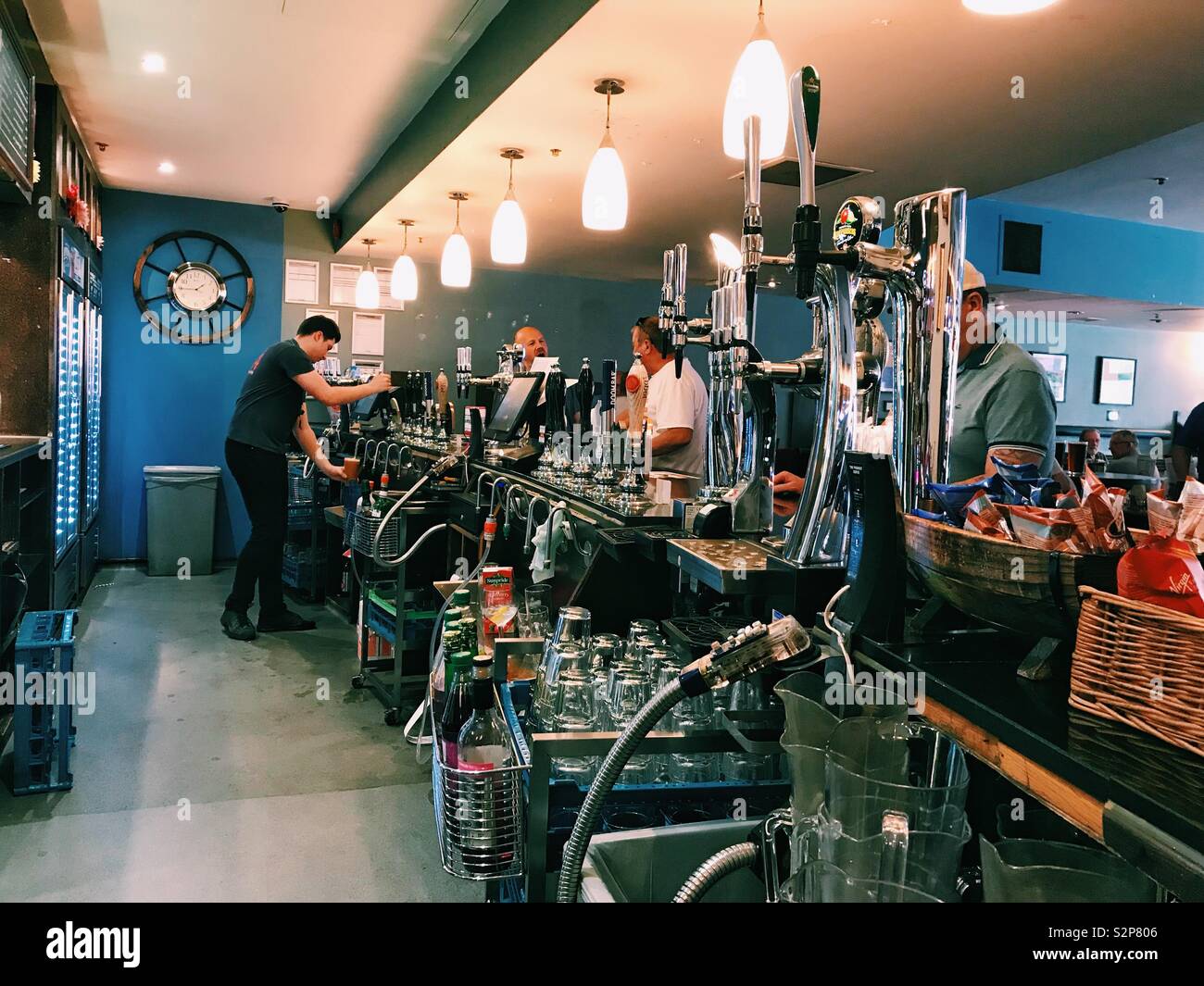 A man working behind a bar in a pub Stock Photo Alamy