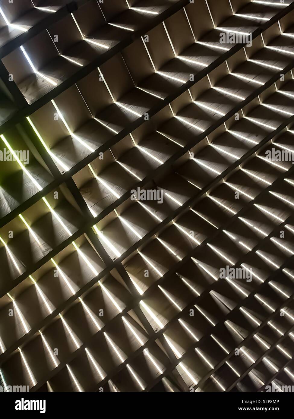 Wooden floor above with light shining through the slates, abstract - Smartphone Captured Stock Image