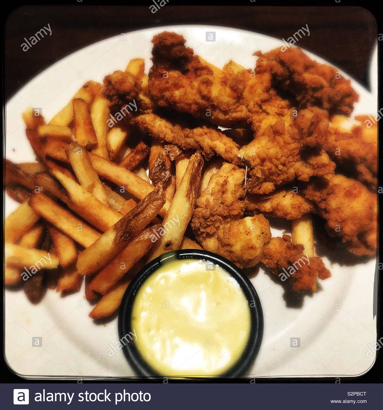 Chicken tenders and French fries with mustard sauce Stock Photo Alamy