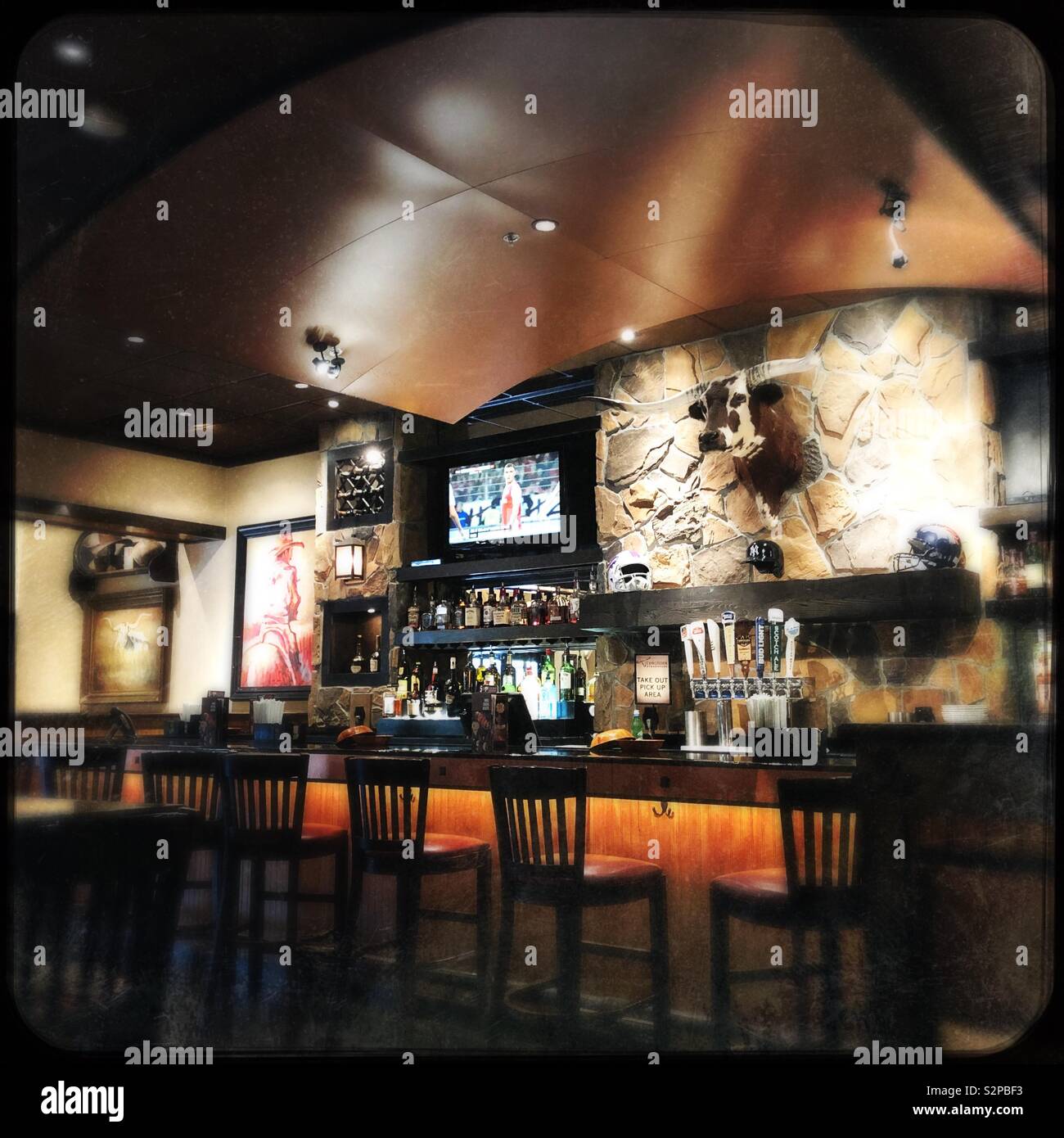 Steak house bar with steer head - Smartphone Captured Stock Image