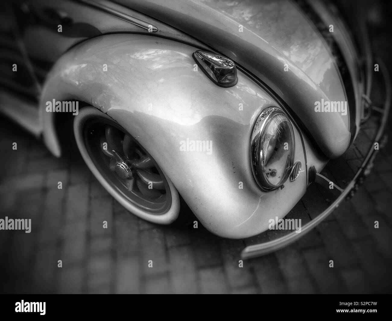Vintage Volkswagen Beetle fender and headlight in sepia tone - Smartphone Captured Stock Image