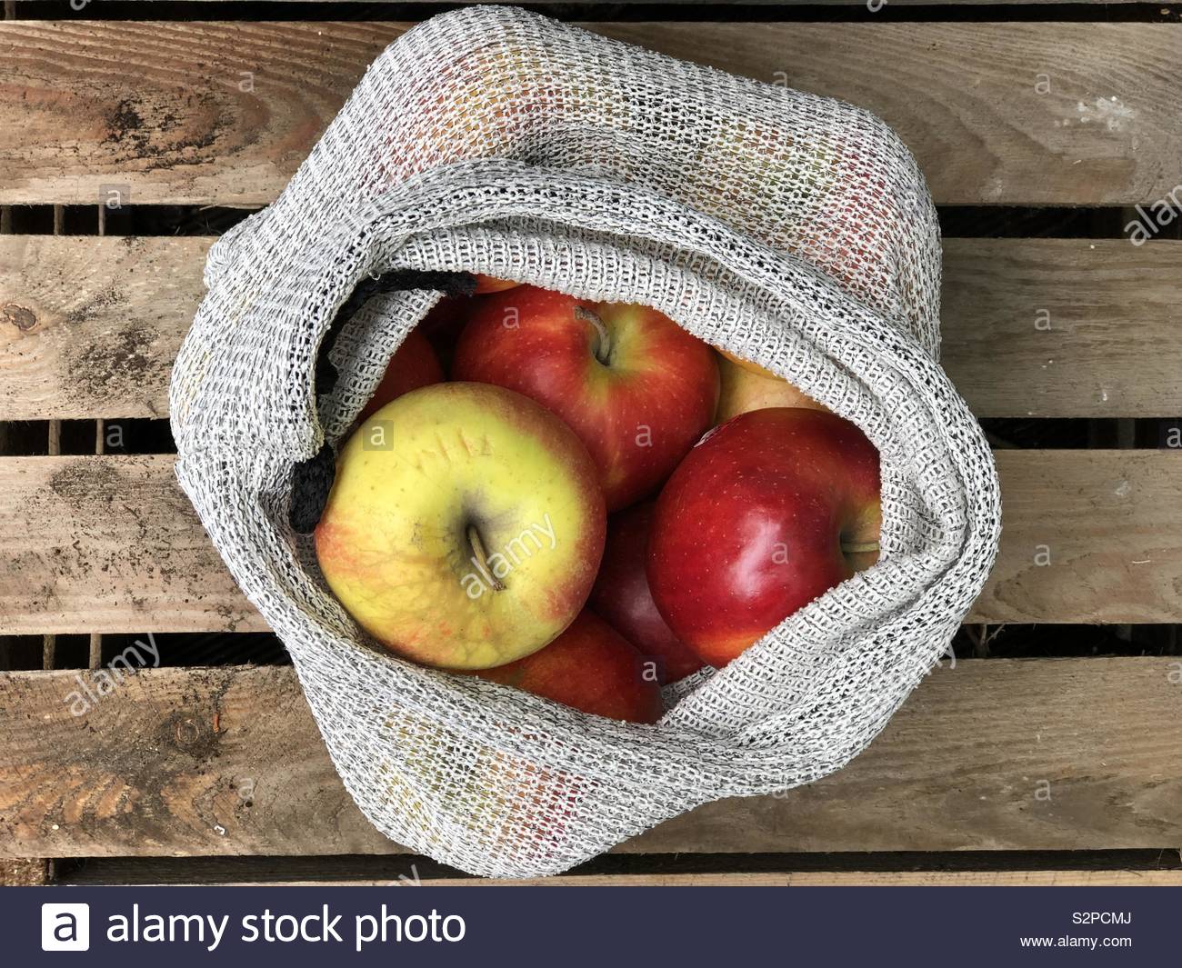 Red apples in a reusable bag Stock Photo