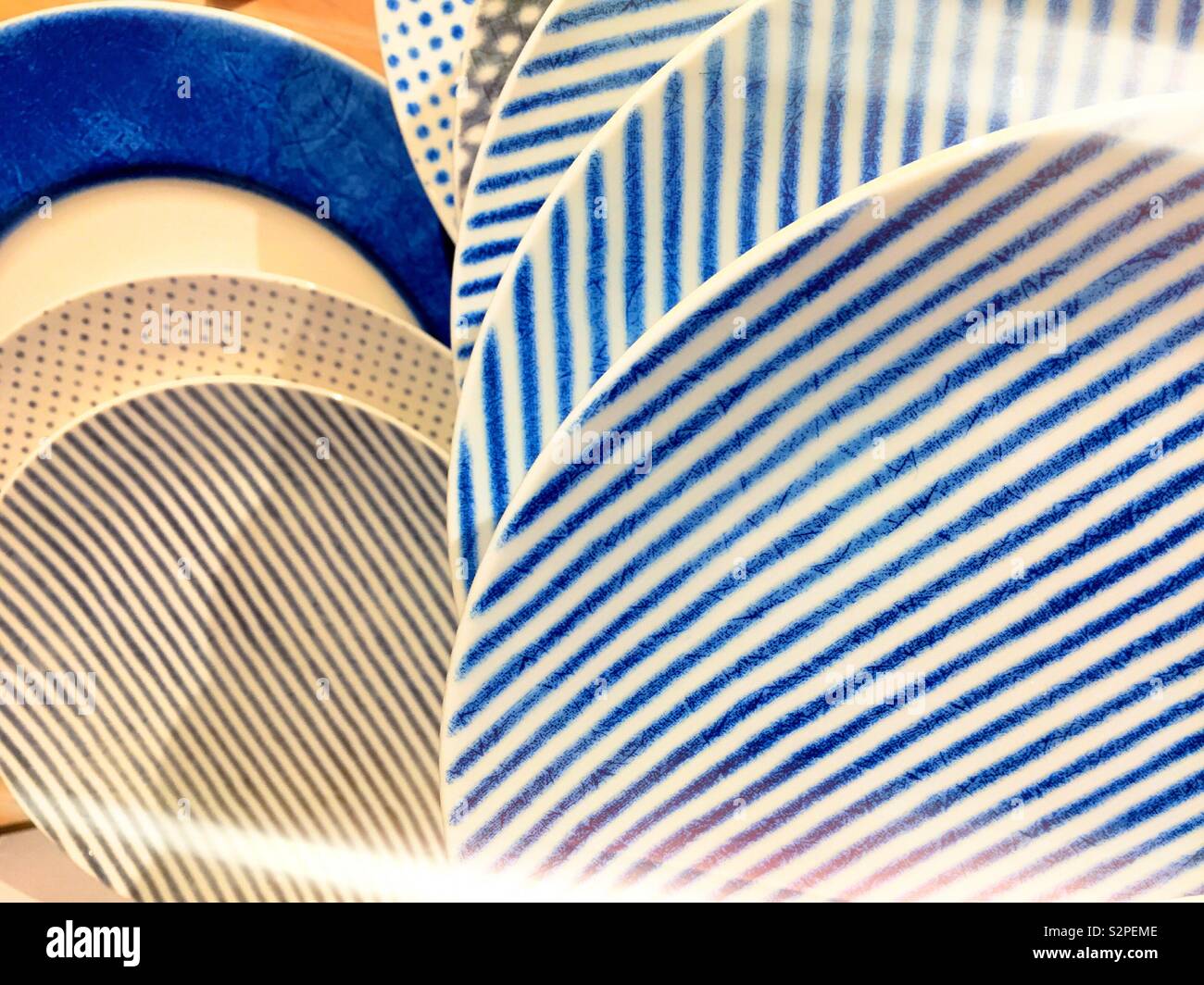 Close-up of striped and polkadot pattern plates - Smartphone Captured Stock Image