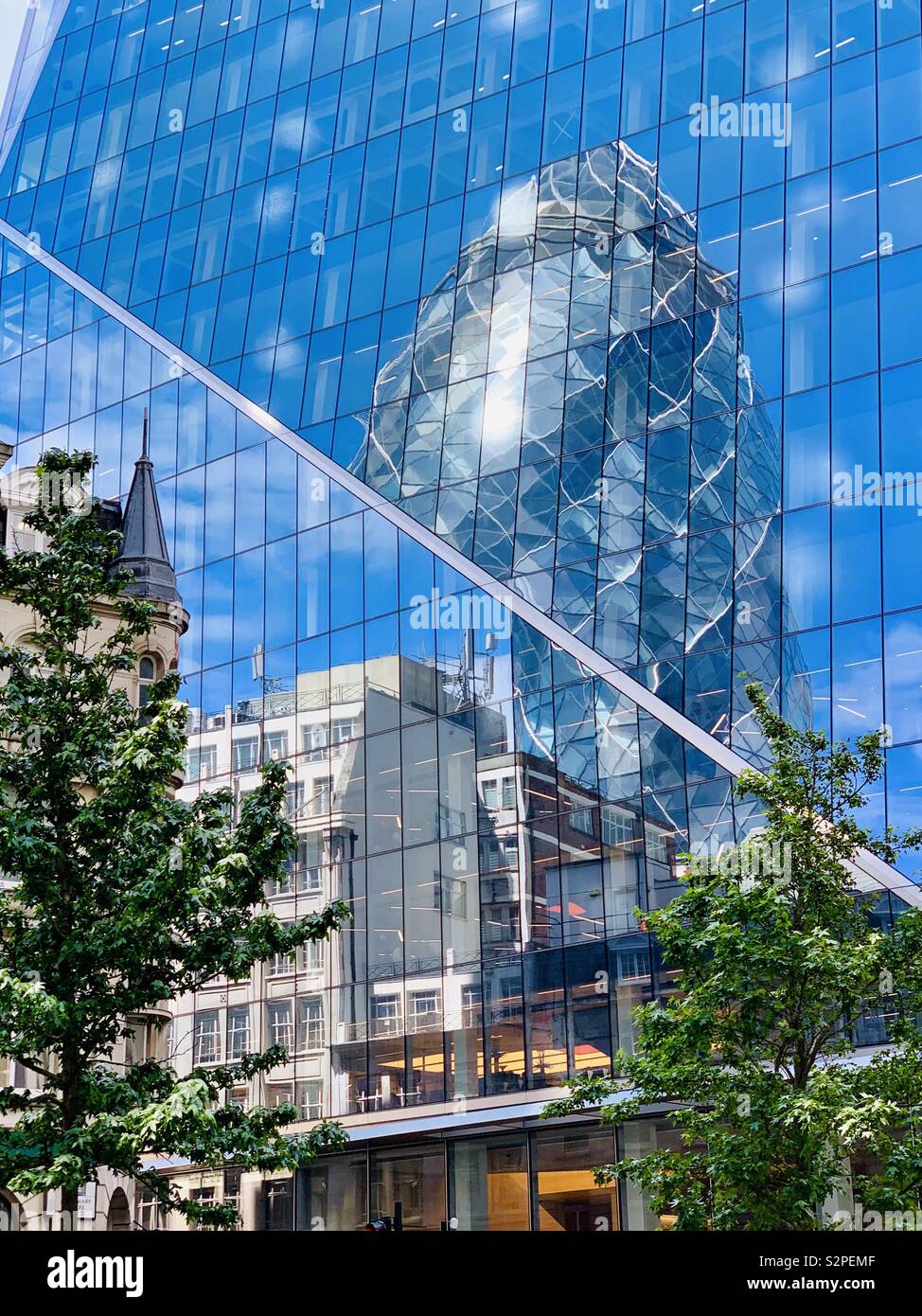 London, UK - 6th June 2019: The Gherkin and The Scalpel. Skyscrapers in the City of London. - Smartphone Captured Stock Image