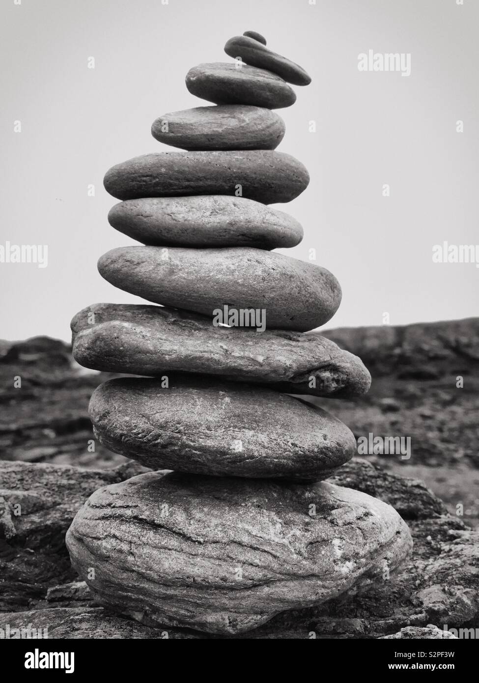 Pile of pebbles and stones.  Building for the future and savings concept.  Stack of rocks - Smartphone Captured Stock Image