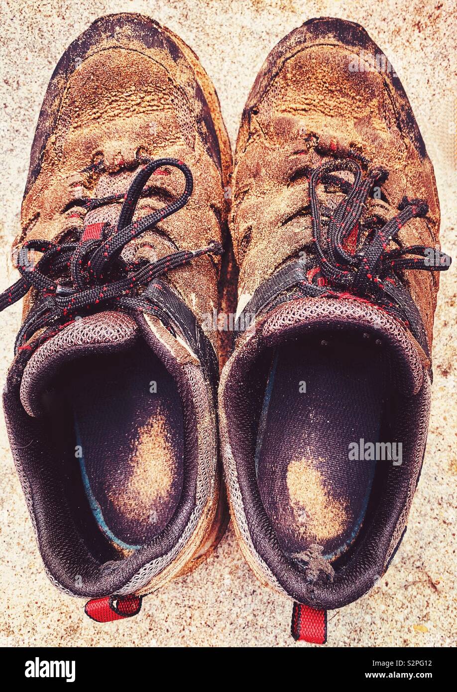 Pair of walking shoes covered with sand after walk on beach Stock Photo -  Alamy