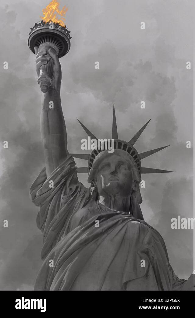 Statue of Liberty with fire in torch Stock Photo Alamy
