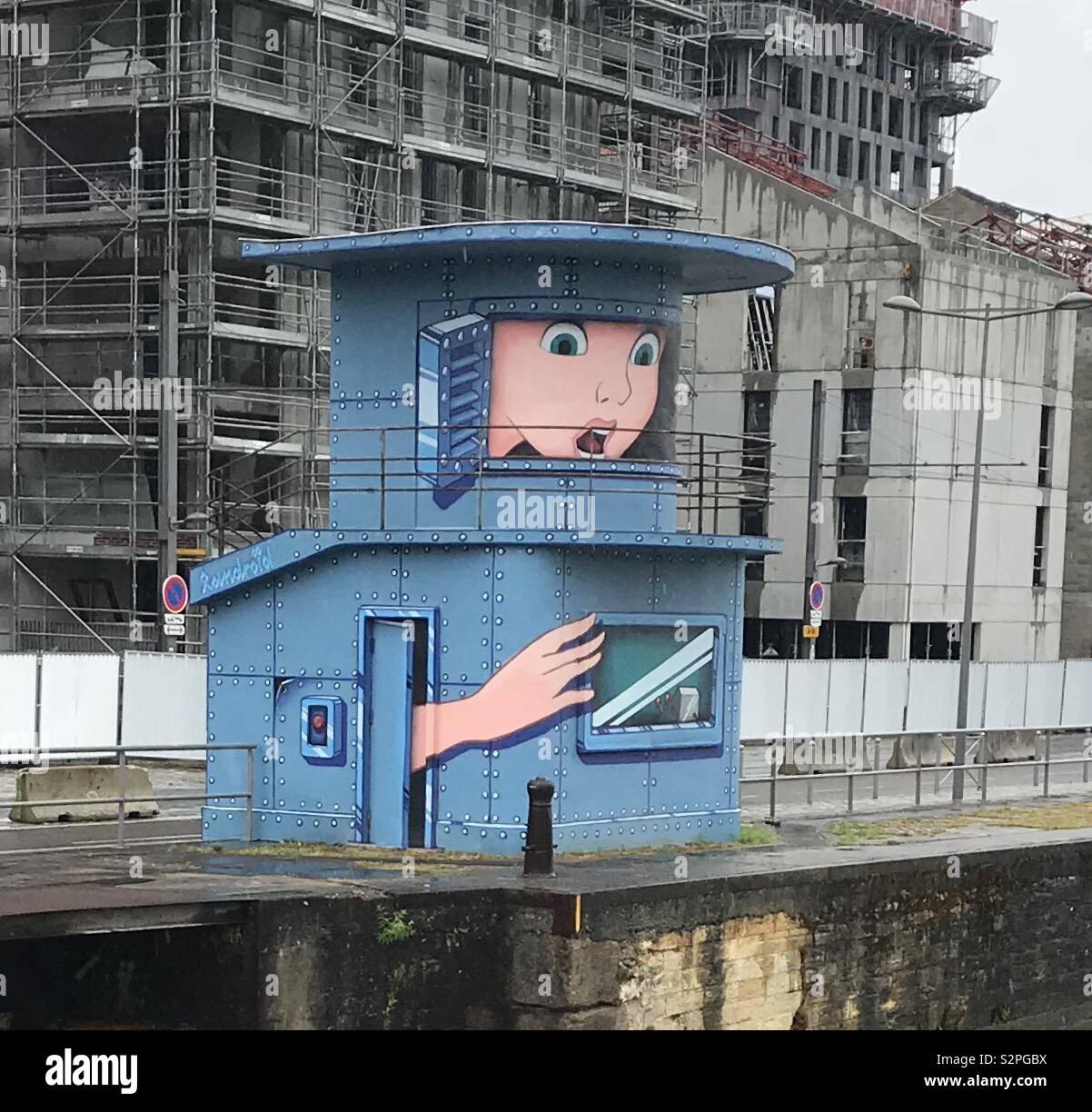 Lock gate building in Bordeaux looks like a person looking out of it Stock Photo