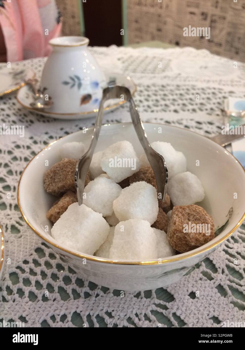 Sugar cubes and tongs Stock Photo Alamy