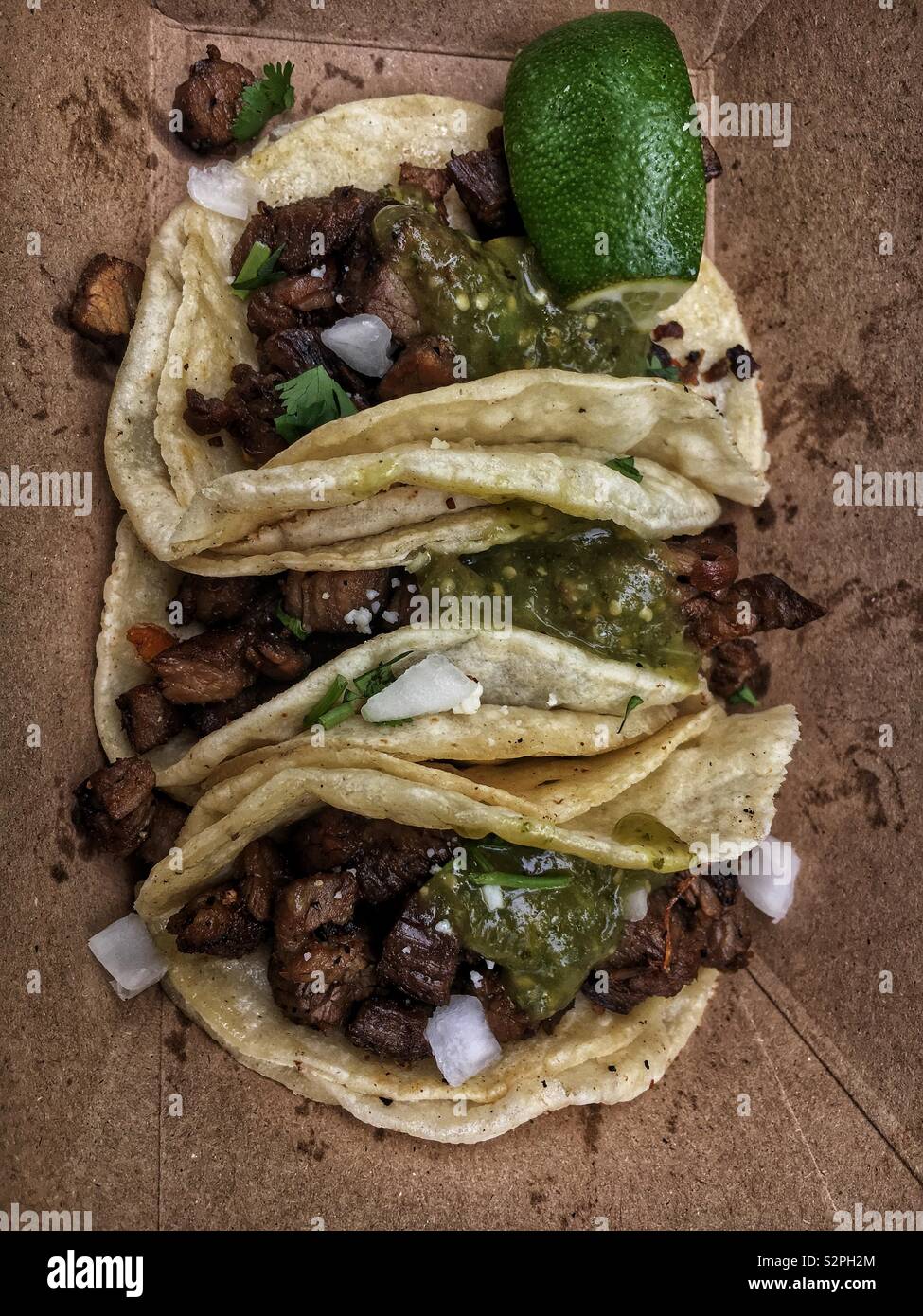 Three fresh delicious Mexican steak tacos Stock Photo - Alamy