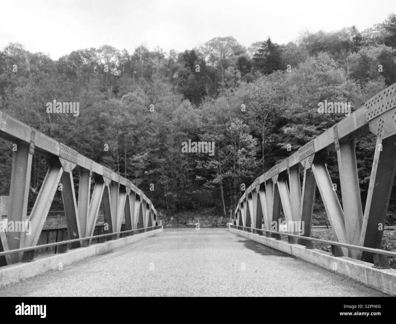 Black and white image of a bridge in a rural area - Smartphone Captured Stock Image