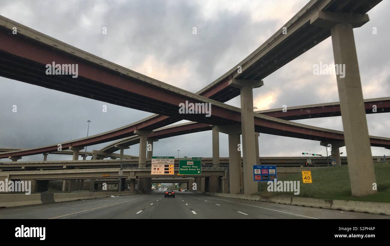 CARROLLTON, TX, MAY 2019: massive highway interchange with signs to toll expressways and other exits on the freeway Stock Photo