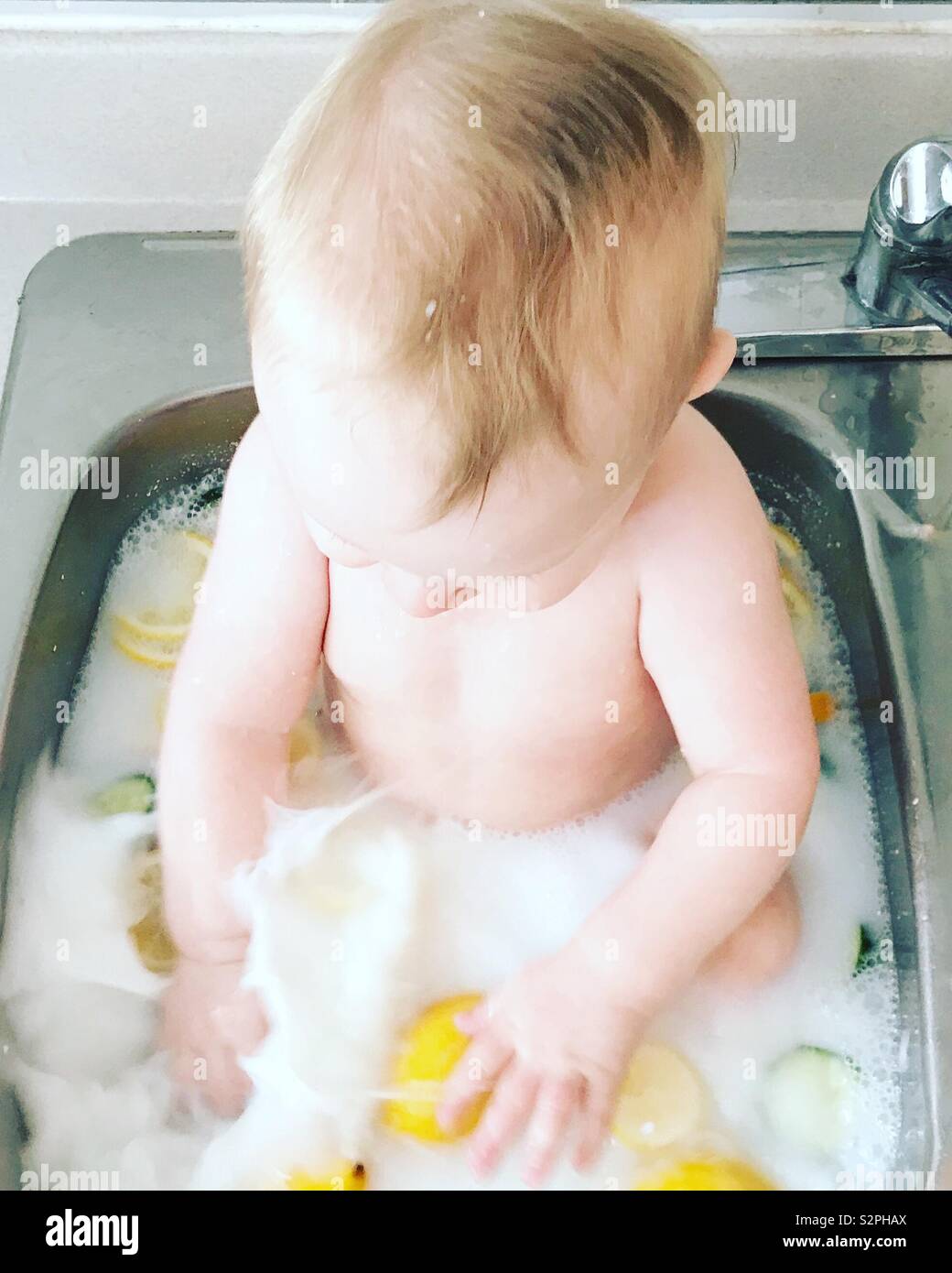 Baby in milk bath Stock Photo Alamy