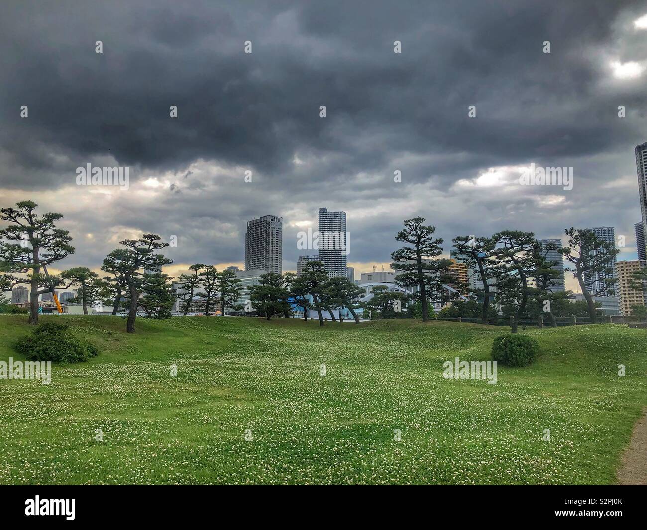 Cloudy skies at Hama-rikyu gardens in Tokyo, Japan Stock Photo