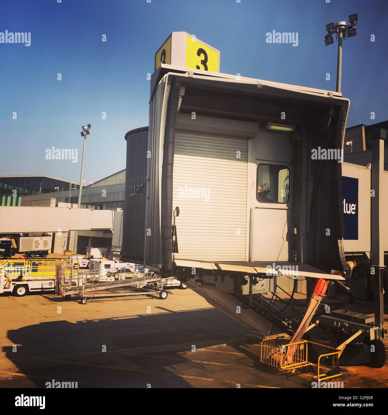 Sky bridge retracted from an airplane at Bradley International Airport, Windsor Locks, Connecticut, United States - Smartphone Captured Stock Image