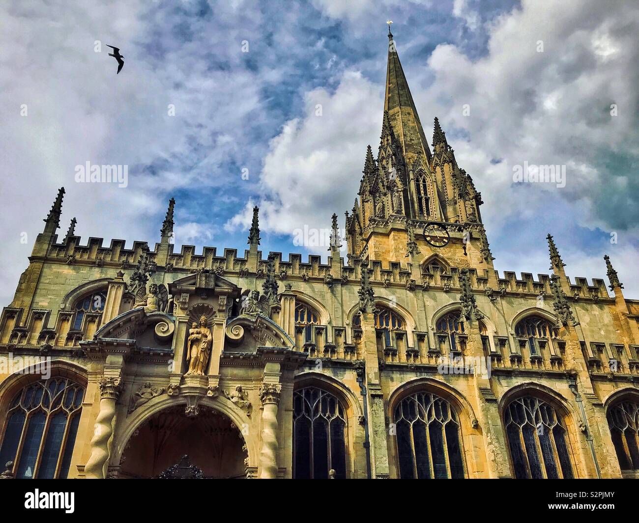 A view of the Parish Church of Saint Mary the Virgin, opposite the Radcliffe Camera Building in Oxford, England. This CofE church is an integral part of Oxford University. PhotoCredit © COLIN HOSKINS. - Smartphone Captured Stock Image