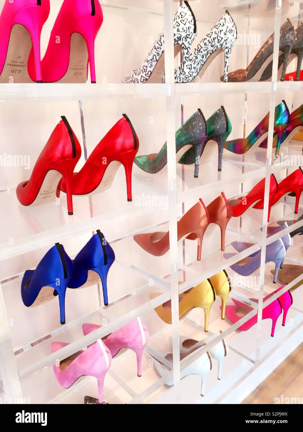 Vibrant designer high heel shoes at the Sarah Jessica Parker boutique in the South St., Seaport, Manhattan, New York City, United States Stock Photo