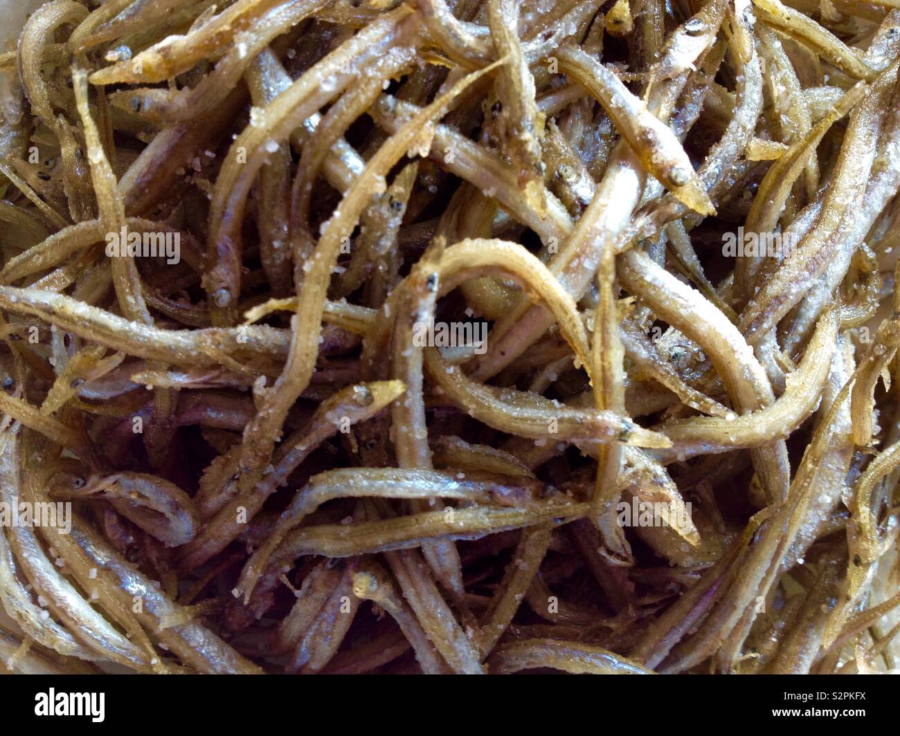 Pescaito frito. Fried fish. Mediterranean Sand Eels (Gymnammodytes cicerelus) Stock Photo