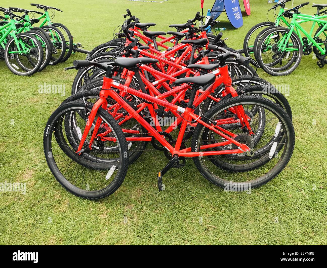 Red bicycles ready for a children’s triathlon - Smartphone Captured Stock Image