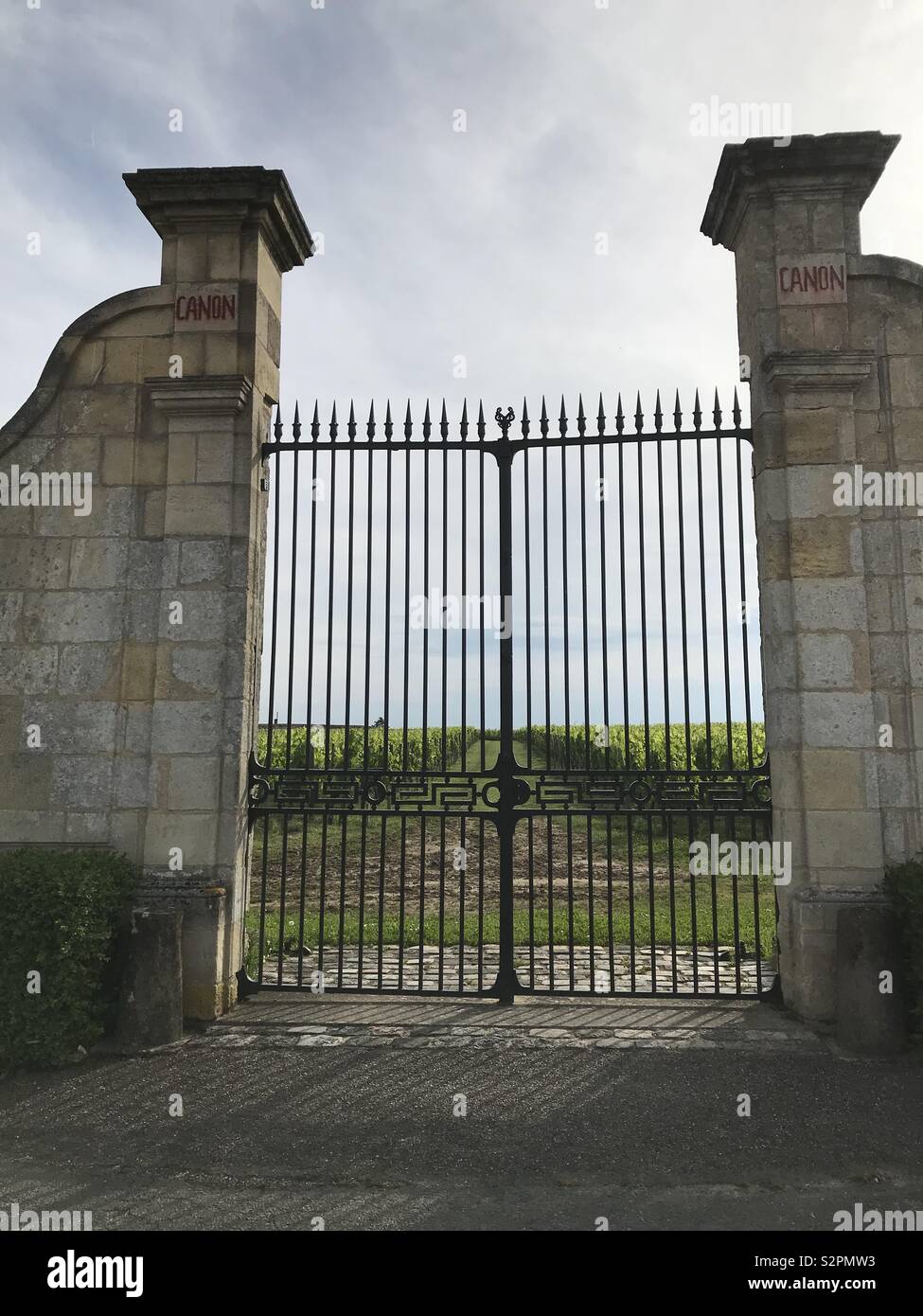 Colour photo of a gateway with Vineyard in the background Stock Photo