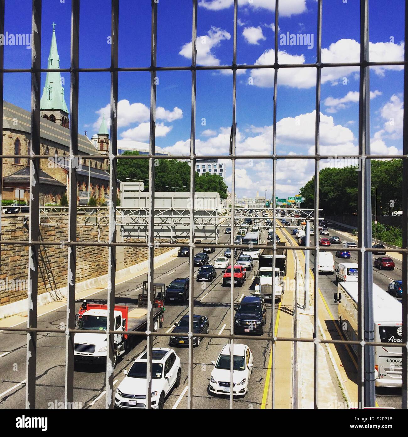 Looking down through a grate on to a highway through Washington, D.C., United States - Smartphone Captured Stock Image
