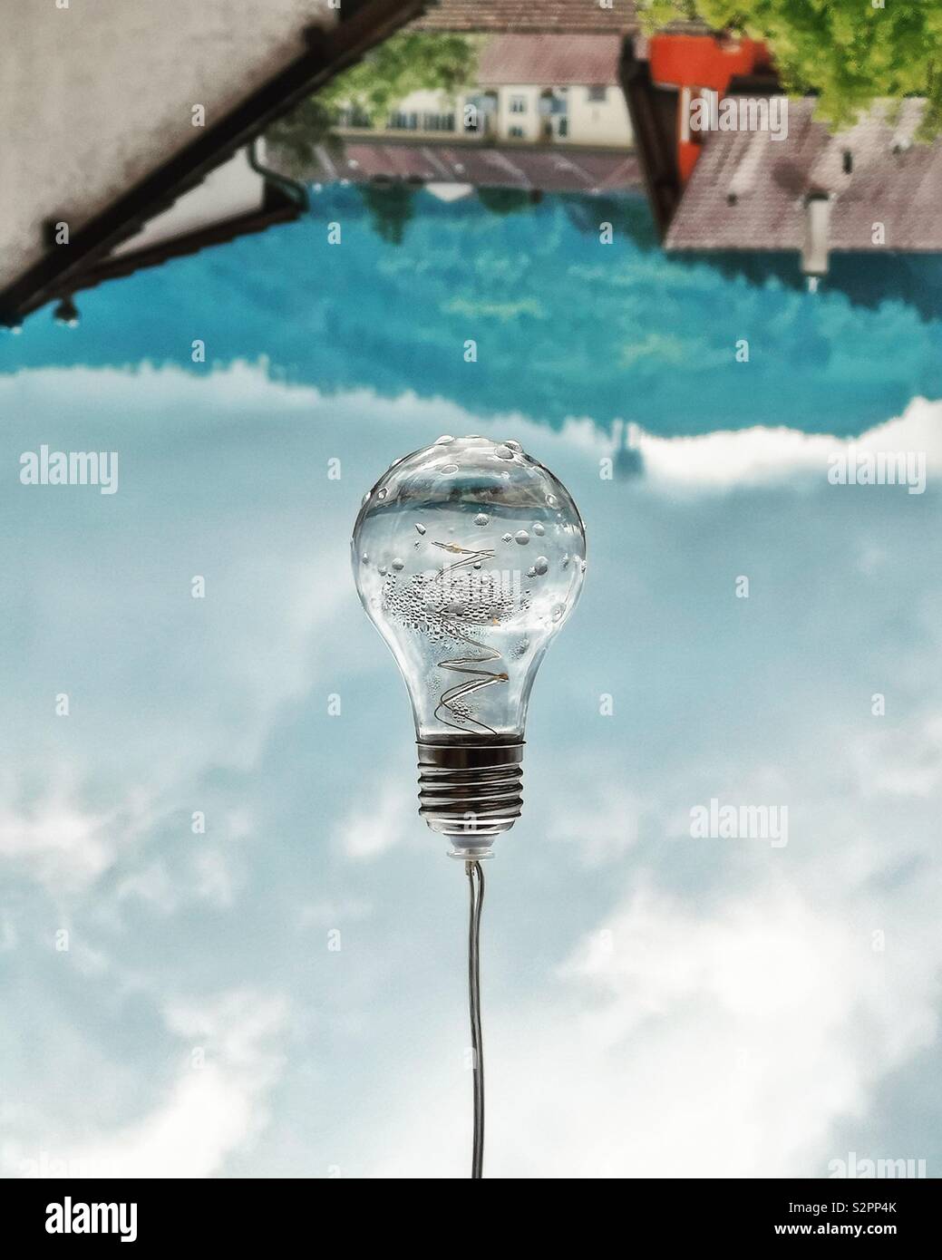 Bright idea: a mysterious floating light bulb - Smartphone Captured Stock Image