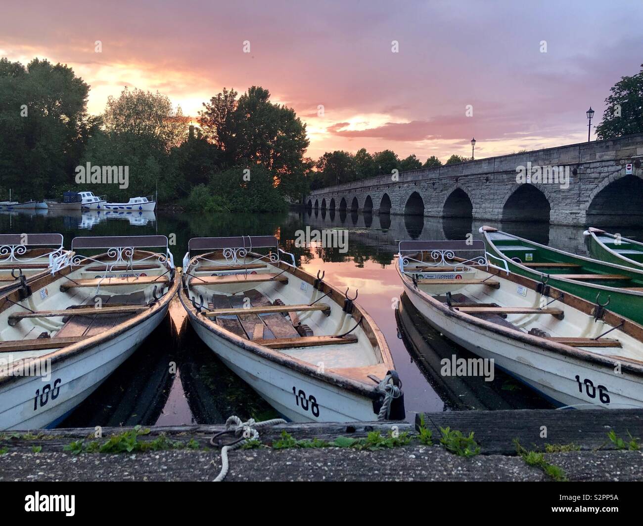 Sunset over rowing boats on river - Smartphone Captured Stock Image