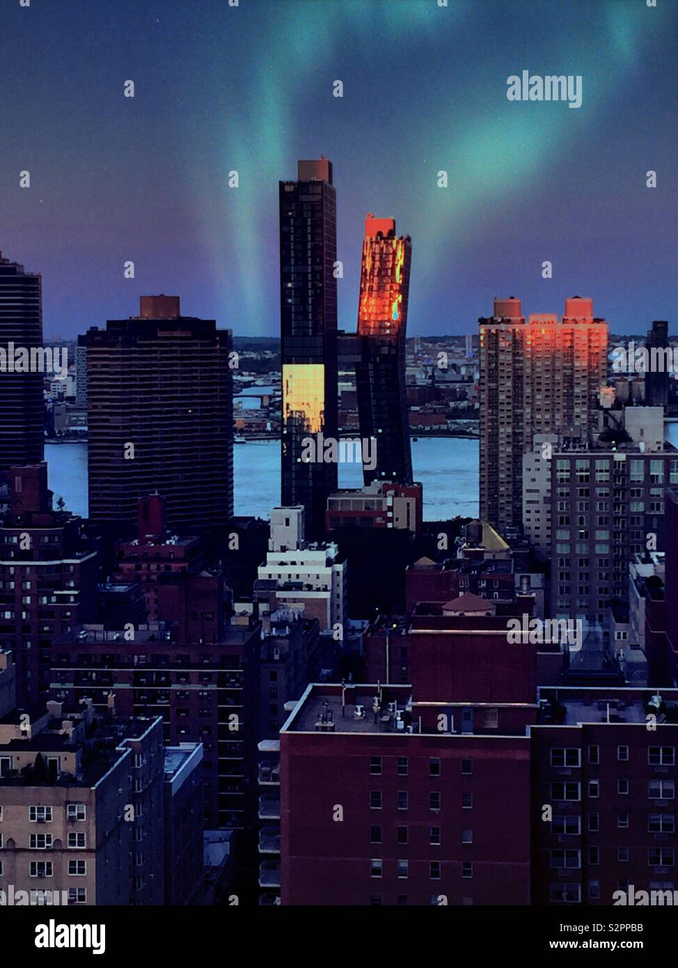Nighttime view of Murray Hill rooftops with the American copper building in the background, NYC, USA - Smartphone Captured Stock Image