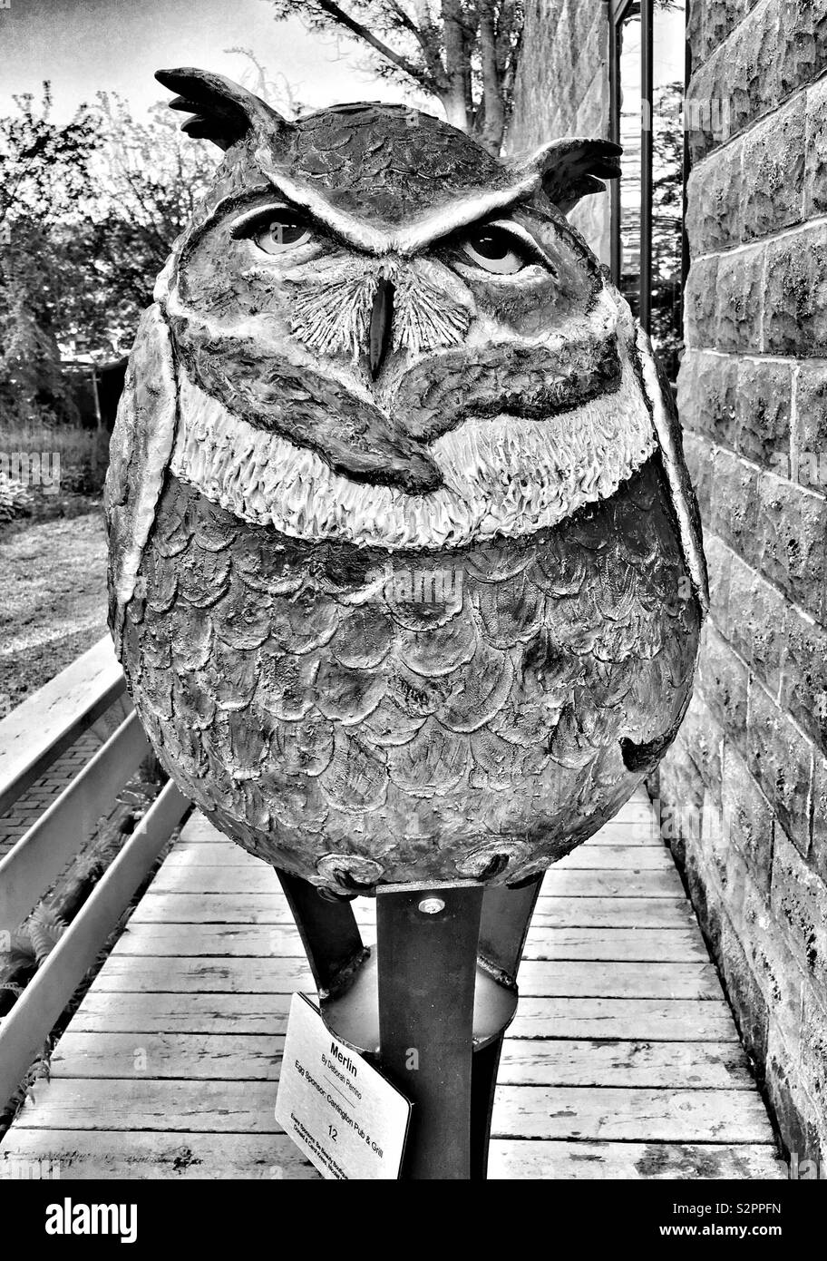 “Merlin” artwork by Deborah Perrino showcases an egg-shaped owl to celebrate EGGstravaganza 2019 in Egg Harbor Wisconsin - Smartphone Captured Stock Image
