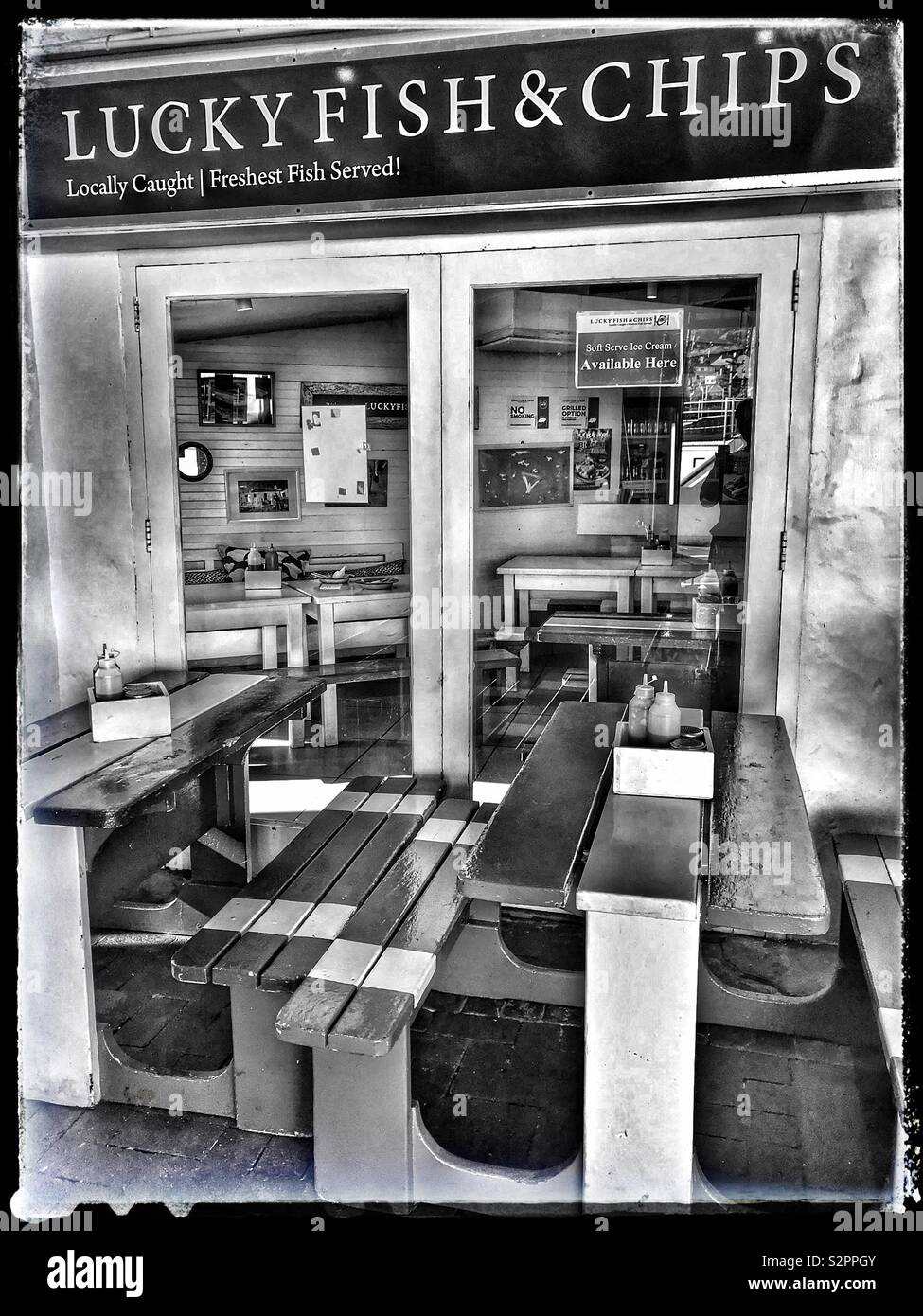 Lucky Fish & Chips,Kalk Bay, South Africa.Black and white photo. Stock Photo