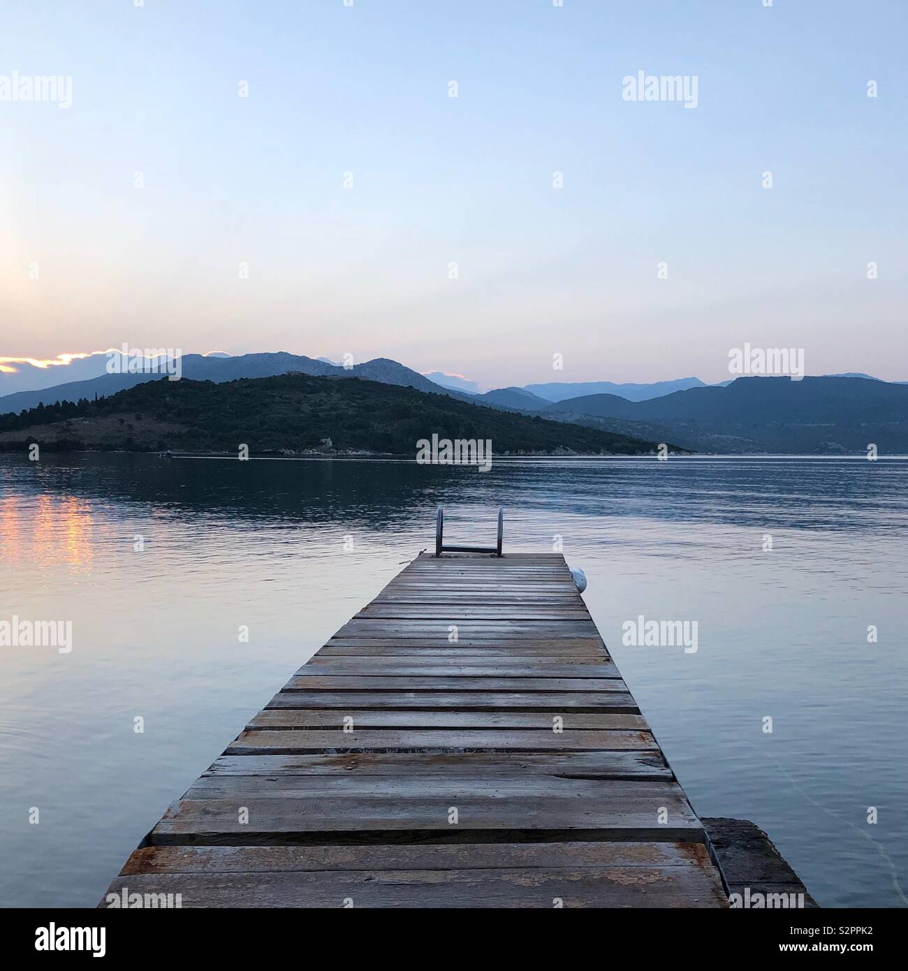 Greek sunrise with jetty - Smartphone Captured Stock Image