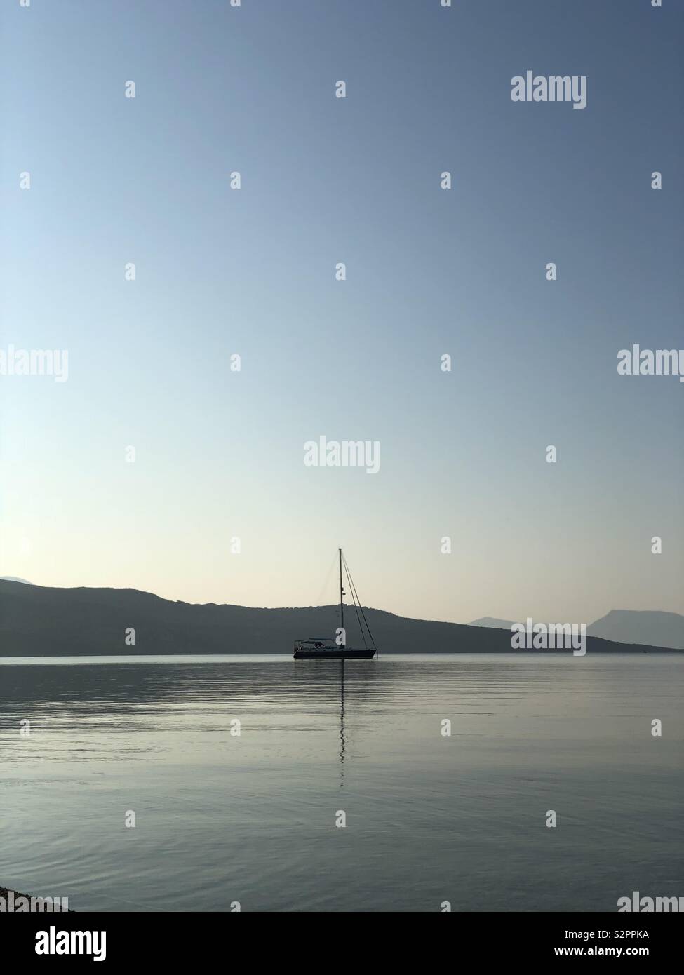 Lone boat on Greek sea - Smartphone Captured Stock Image