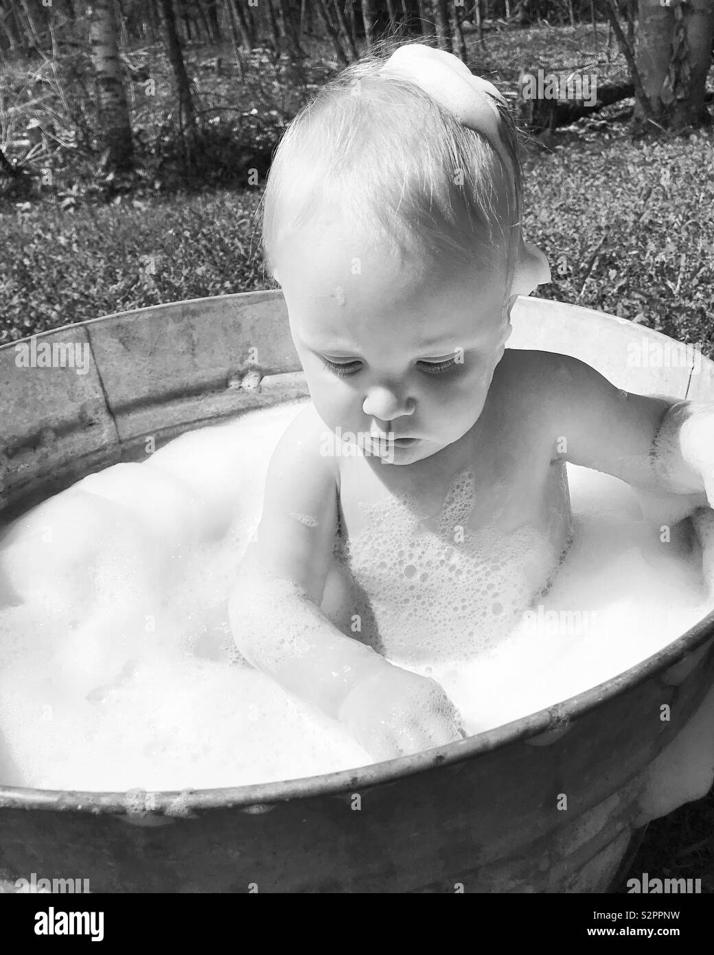 Baby in tub Stock Photo