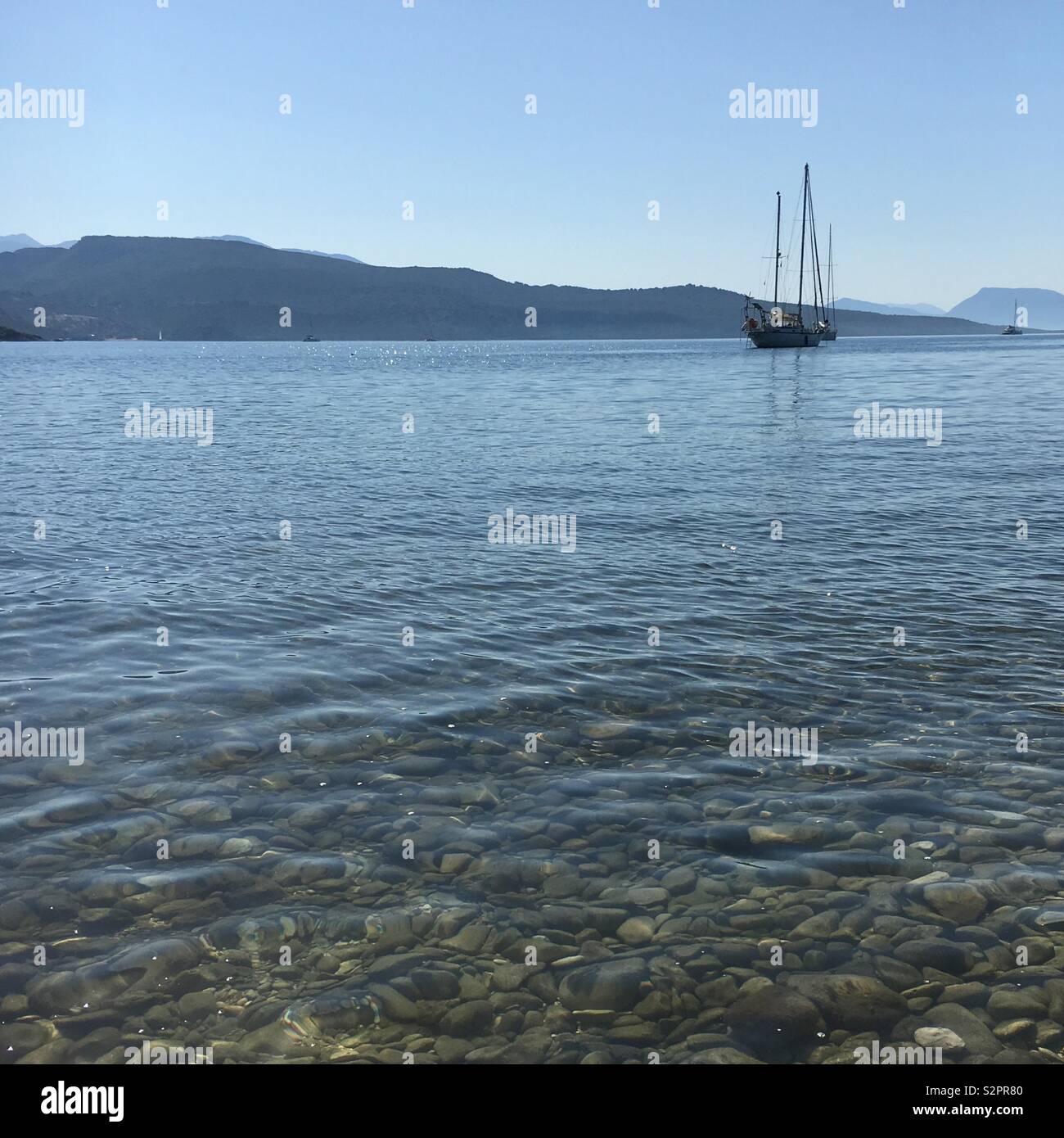 Single boat sailing in Greece - Smartphone Captured Stock Image