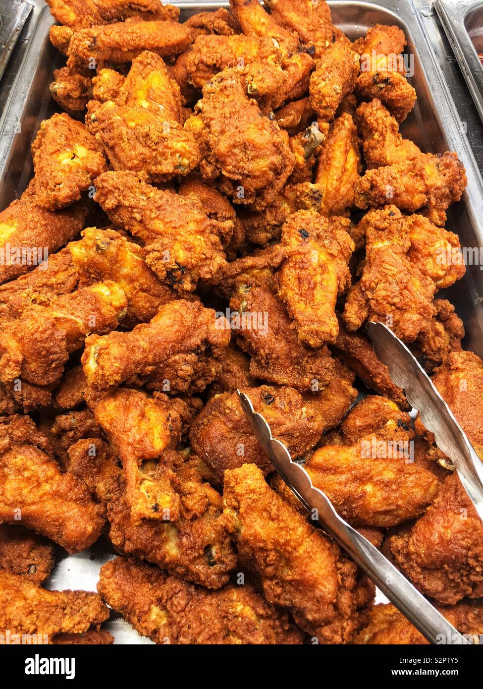 Fresh delicious tasty fried spicy chicken wings. Stock Photo