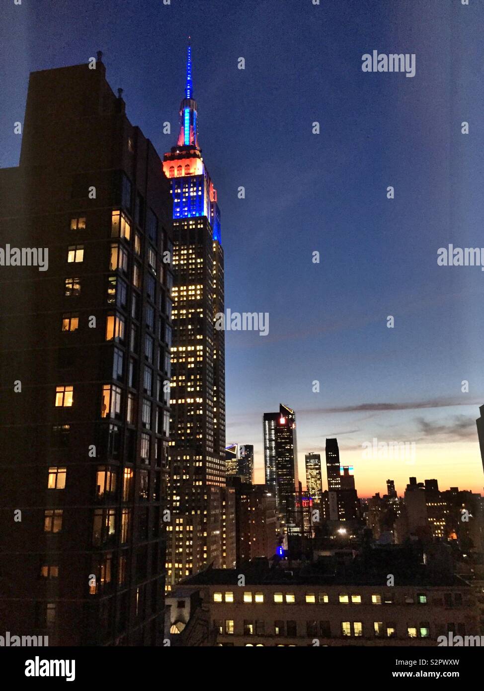 Sunset view of the Empire State building and skyscrapers at Hudson yard, midtown Manhattan, NYC, USA - Smartphone Captured Stock Image