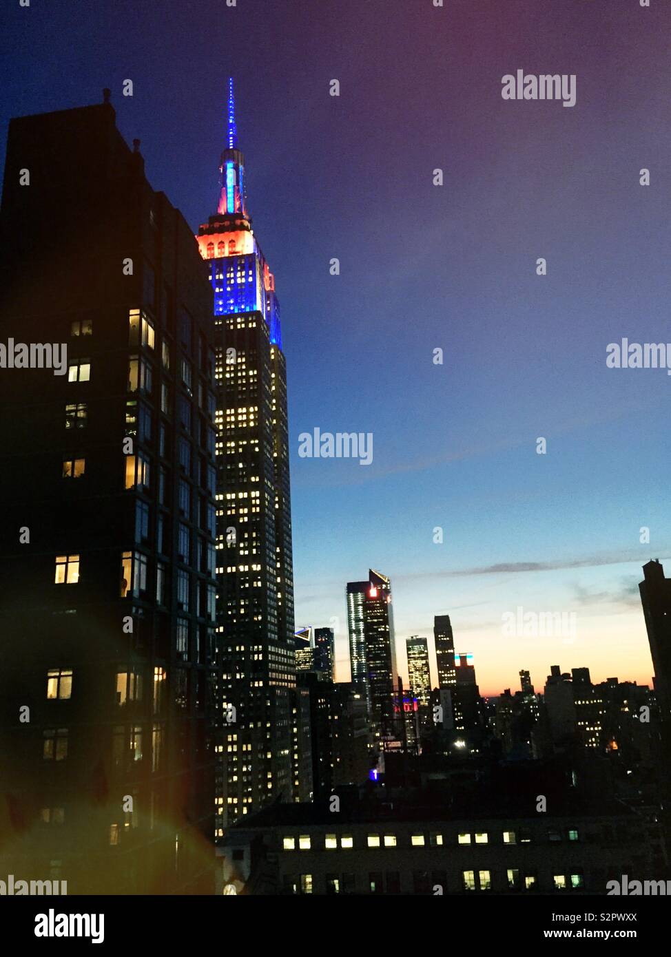 Sunset Vista of the empire state building and skyscrapers in Hudson yards, NYC, USA - Smartphone Captured Stock Image
