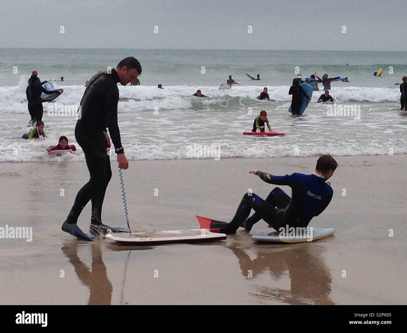 Learning to surf in Cornwall Stock Photo Alamy