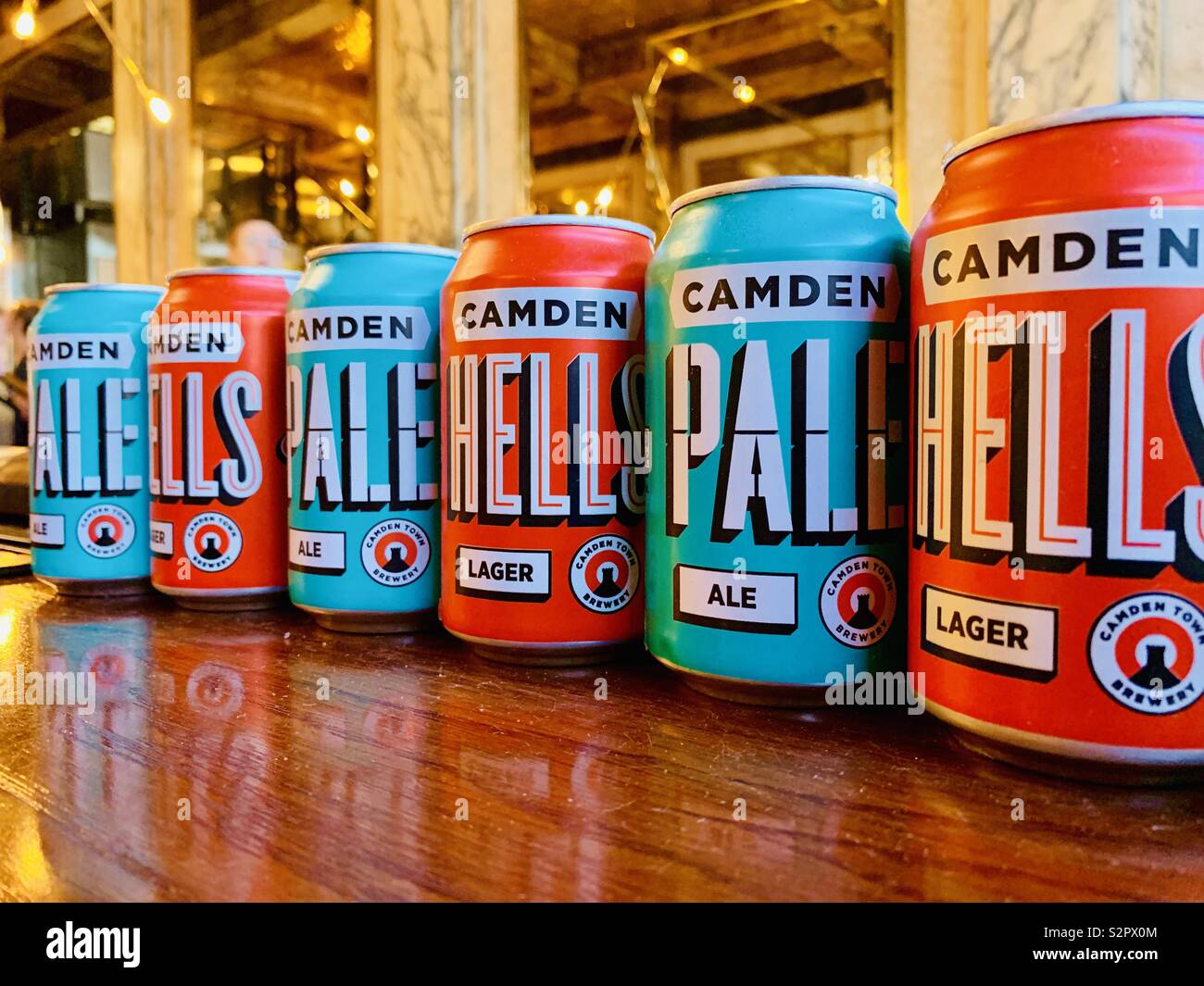 London,UK - 15th June 2019 - Cans of Camden Brewery lager and pale ale lined up in a burger restaurant on The Strand. - Smartphone Captured Stock Image