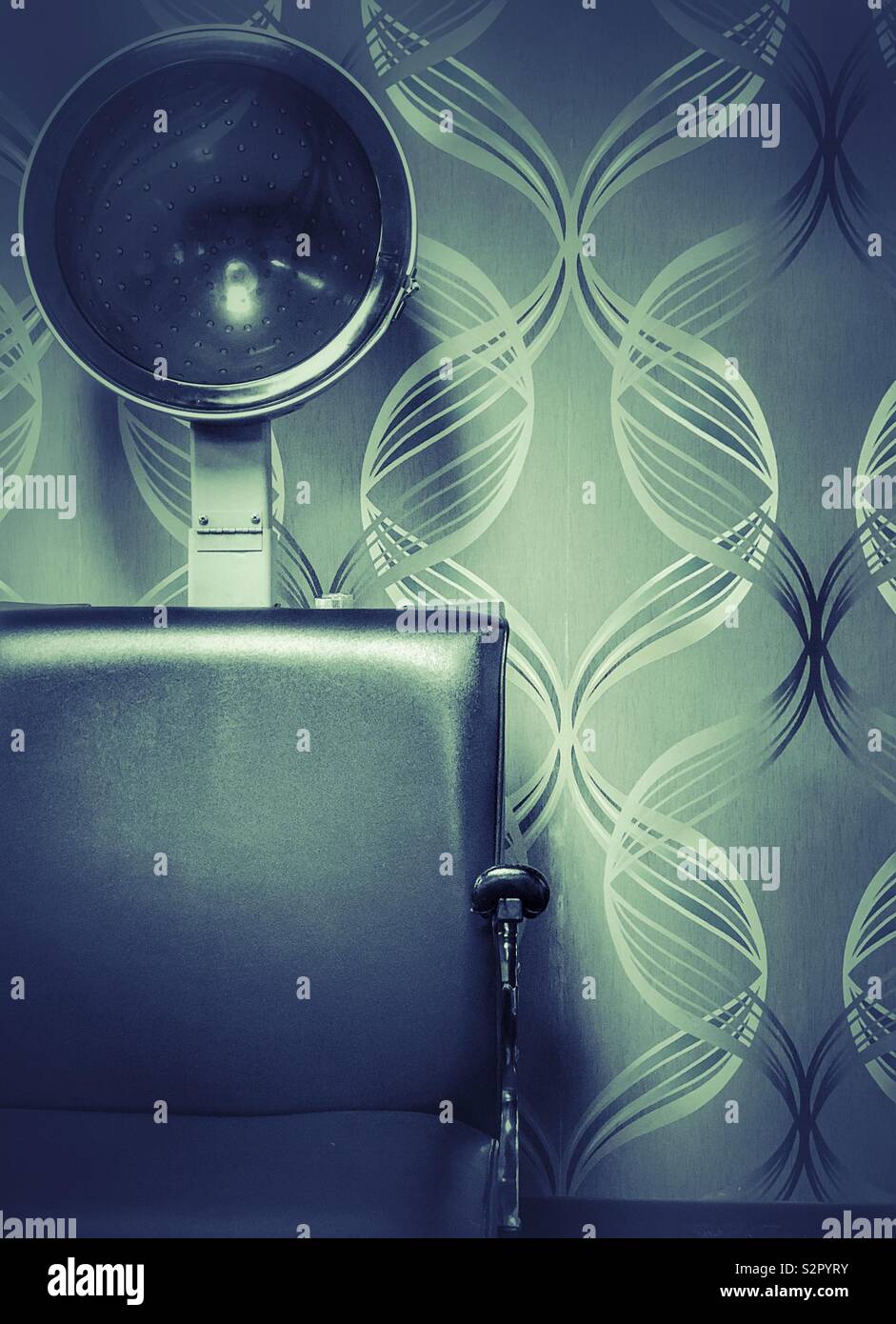 Beauty salon hair dryer against bold wallpaper - Smartphone Captured Stock Image