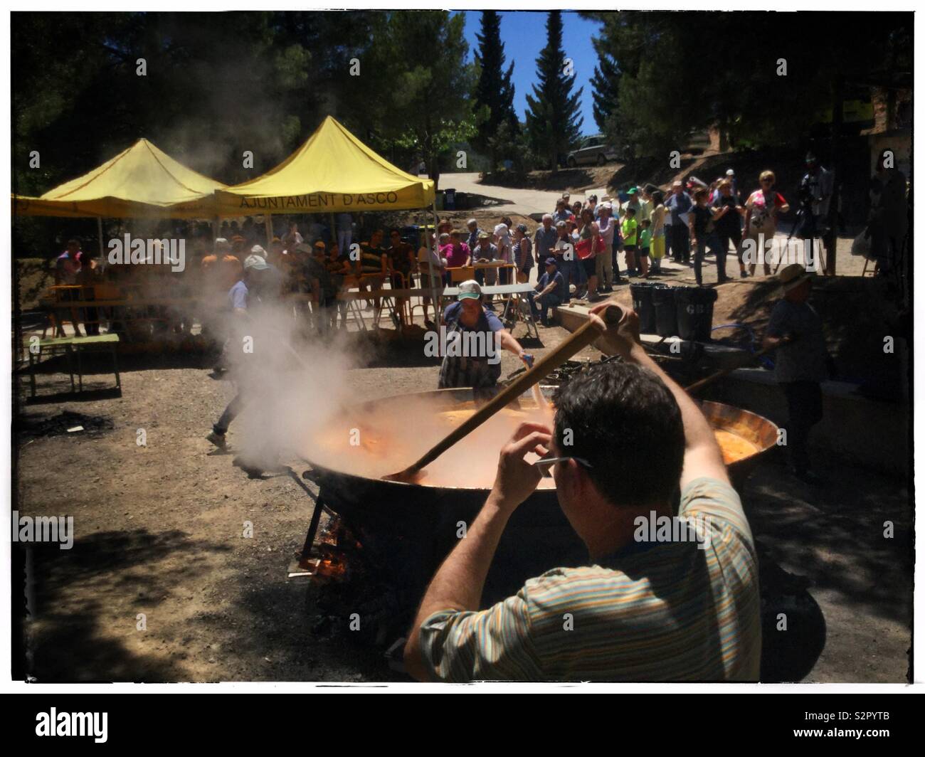 A giant paella at the summer festival of Fiesta Santa Paulina, Ascó, Catalonia, Spain. - Smartphone Captured Stock Image