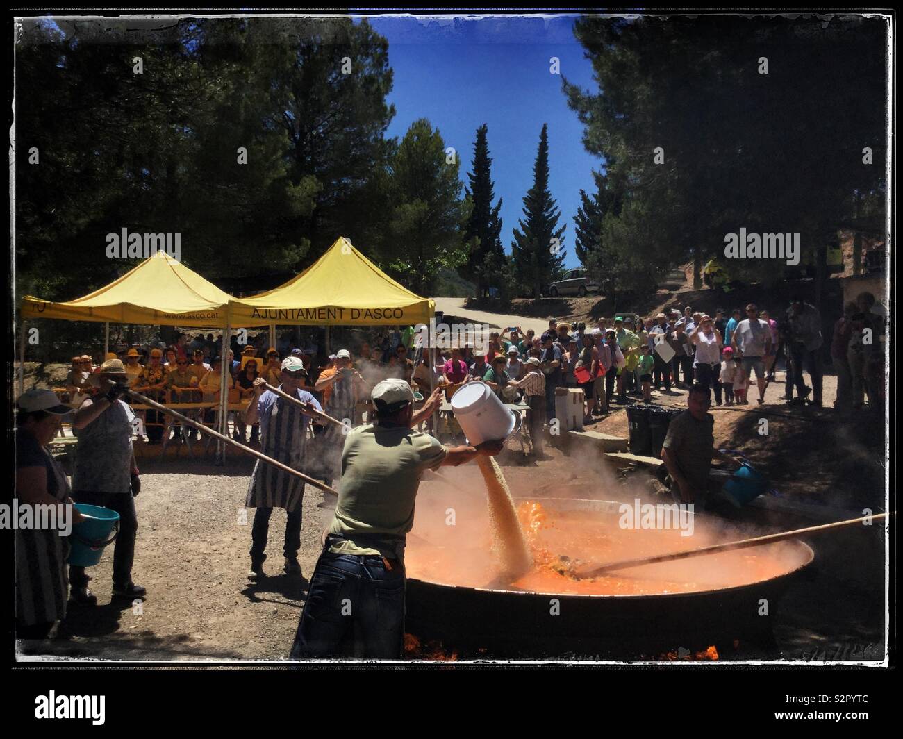 A giant paella at the summer festival of Fiesta Santa Paulina, Ascó, Catalonia, Spain. - Smartphone Captured Stock Image