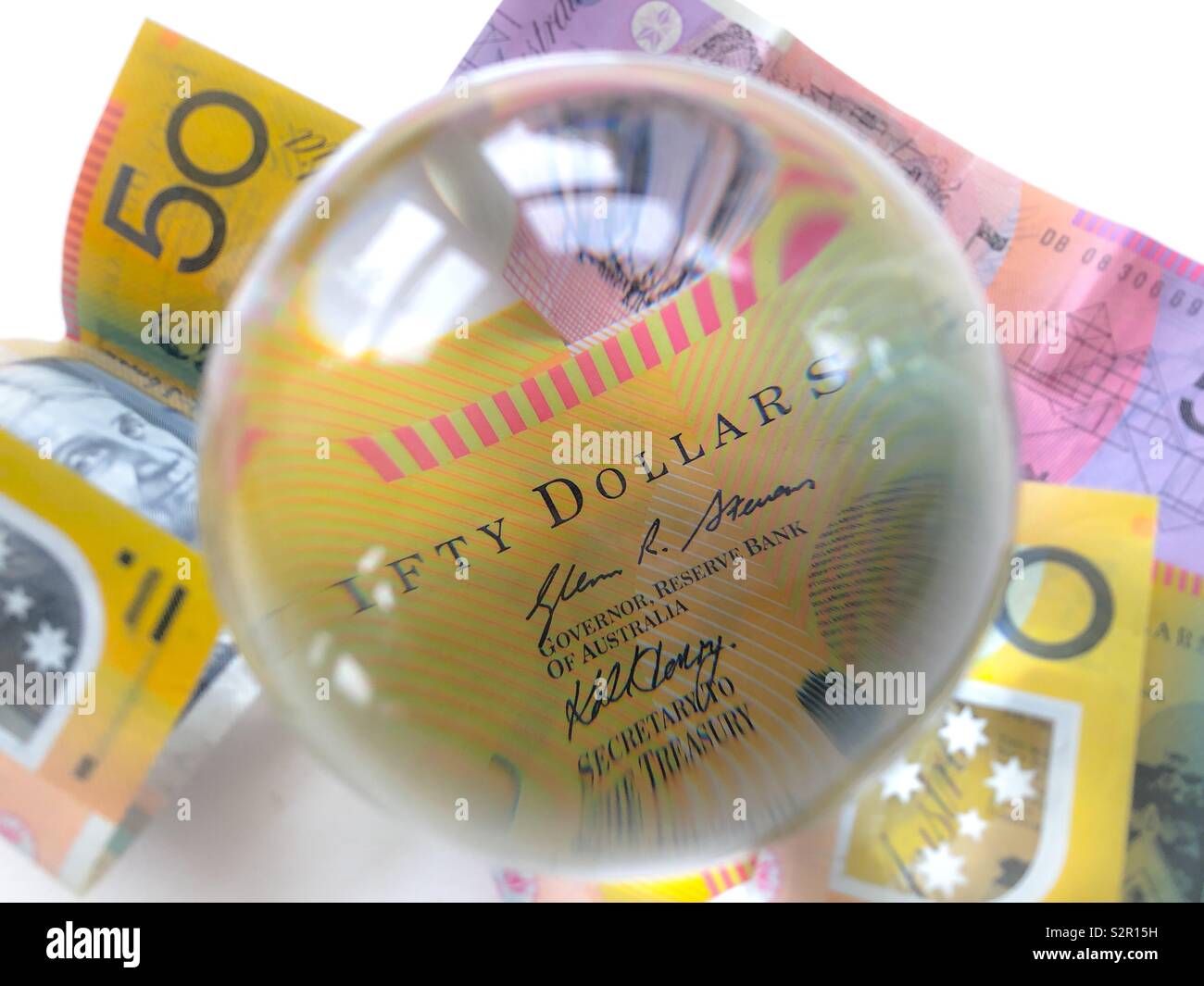 Australia $50 dollar and $5 bills with a crystal ball. Creative concept, predicting the future Stock Photo