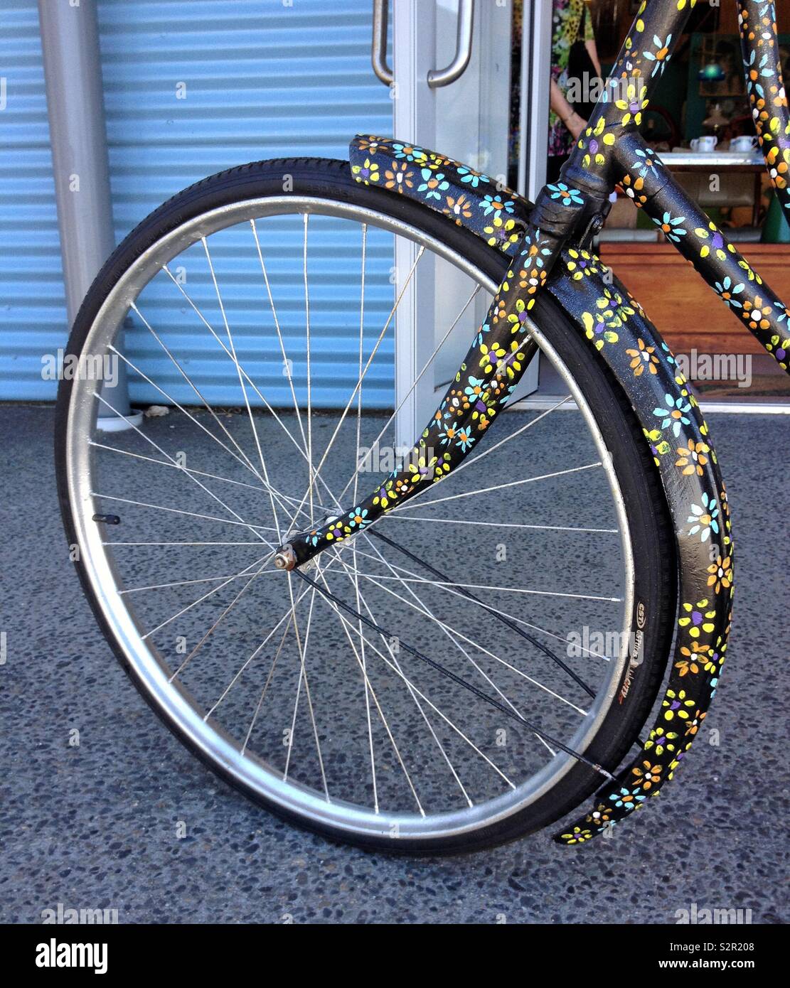 Retro bike wheel with flowers Stock Photo