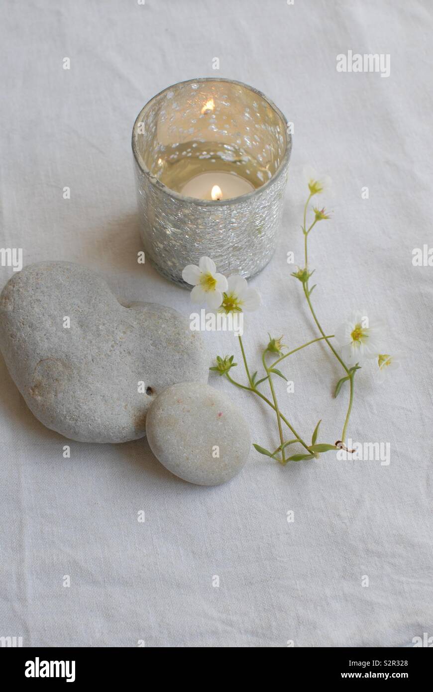 Still life with pebbles and candle - Smartphone Captured Stock Image